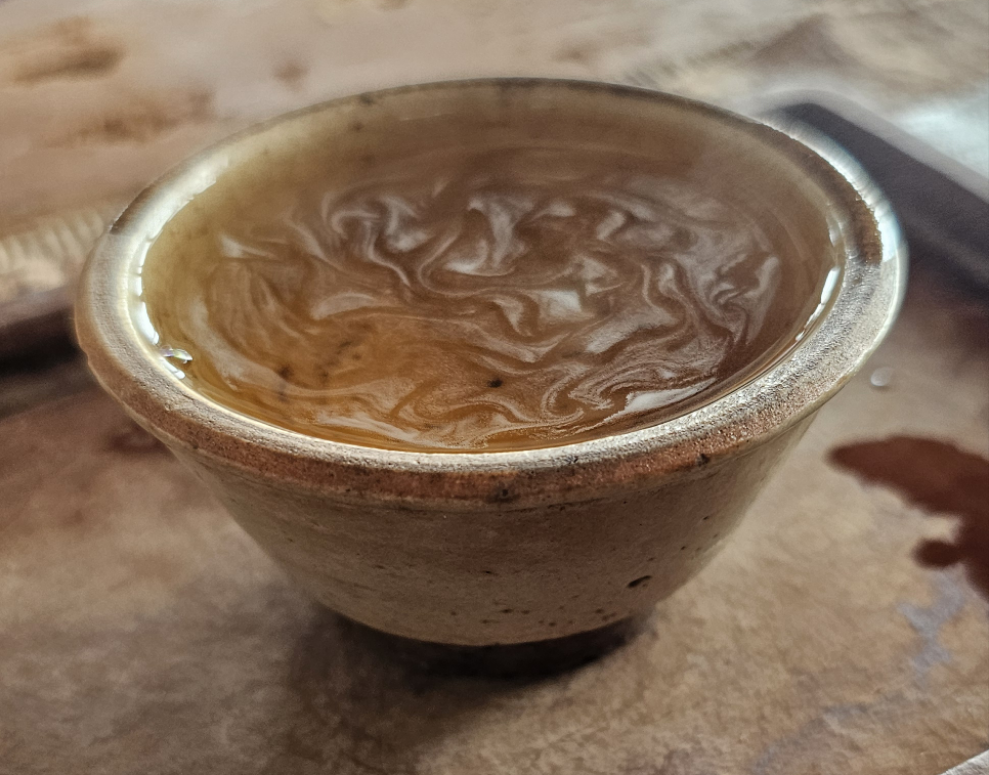 This 2005 Yiwu Sheng Puerh was crafted from ancient trees and aged in Malaysian clay urns. Clean, sweet, and meditative—steeps with clarity and wisdom.