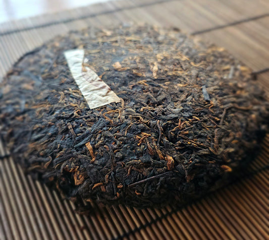 Pressed Dragon Palace 2010 Shu Puerh tea cake with elegant patina