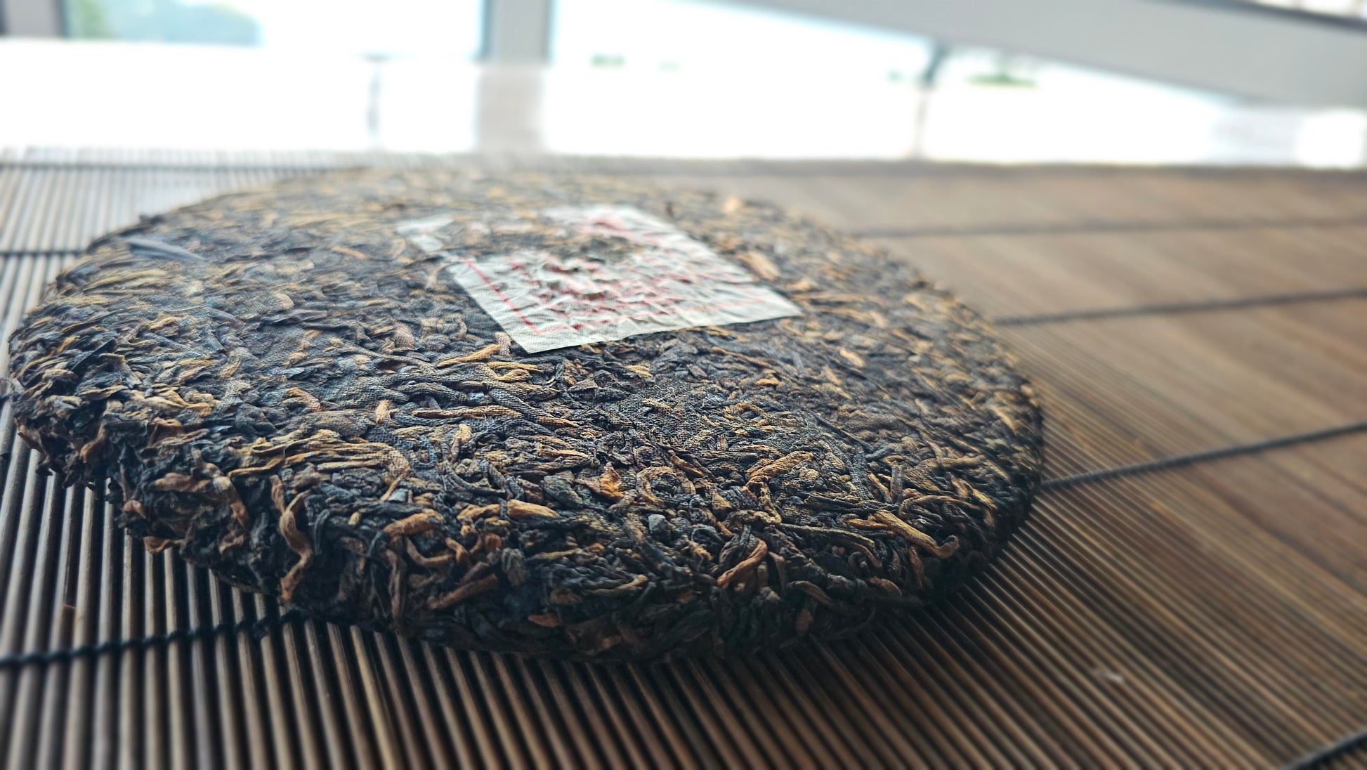 Everyday Prayer Shu Puerh cake from 2012 with aged leaf detail