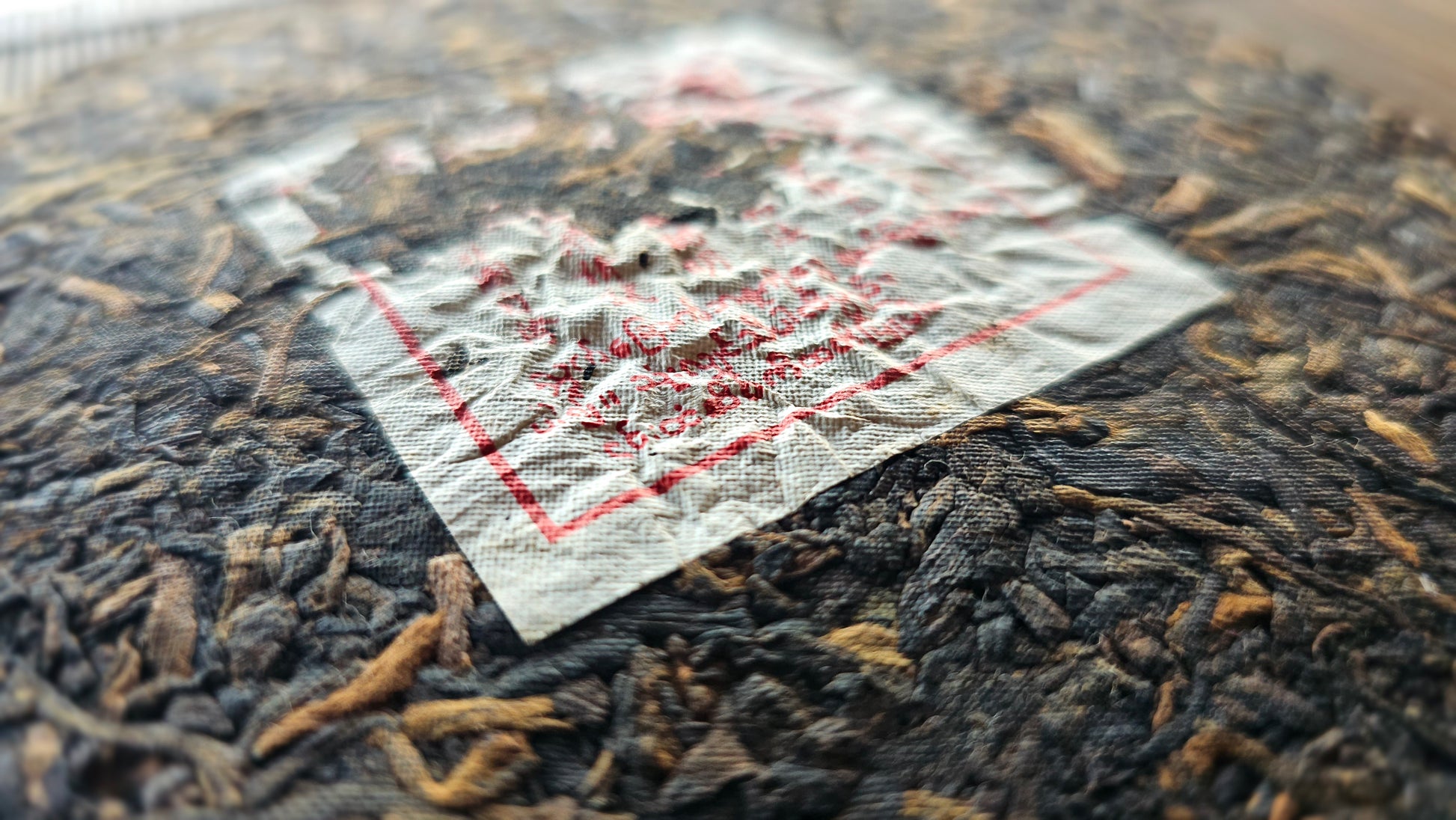 Pressed 2012 Shu Puerh cake labeled Everyday Prayer from Menghai Keyi Xing