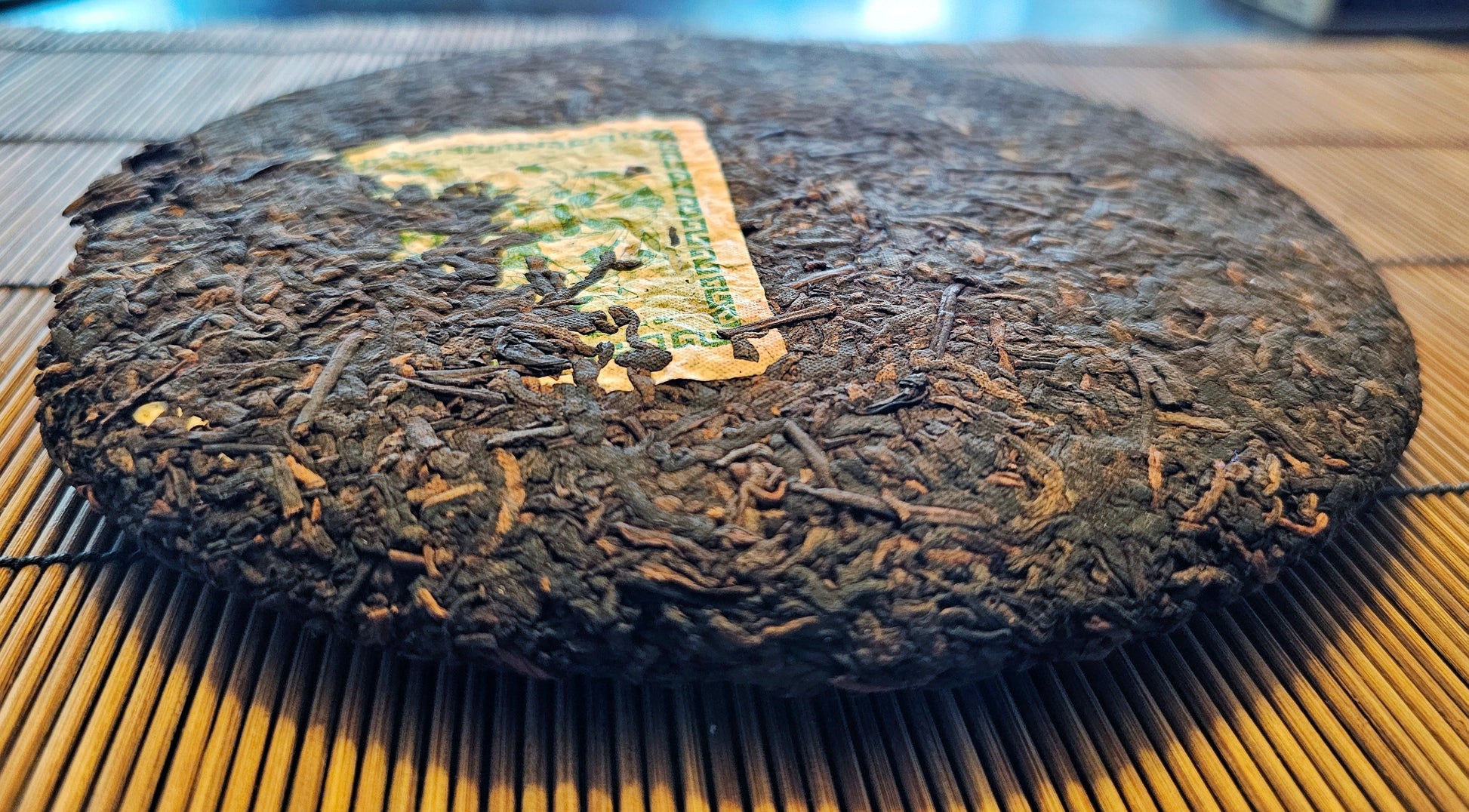 Forest Sage 2007 Shu cake with smooth edges and deep roast patina