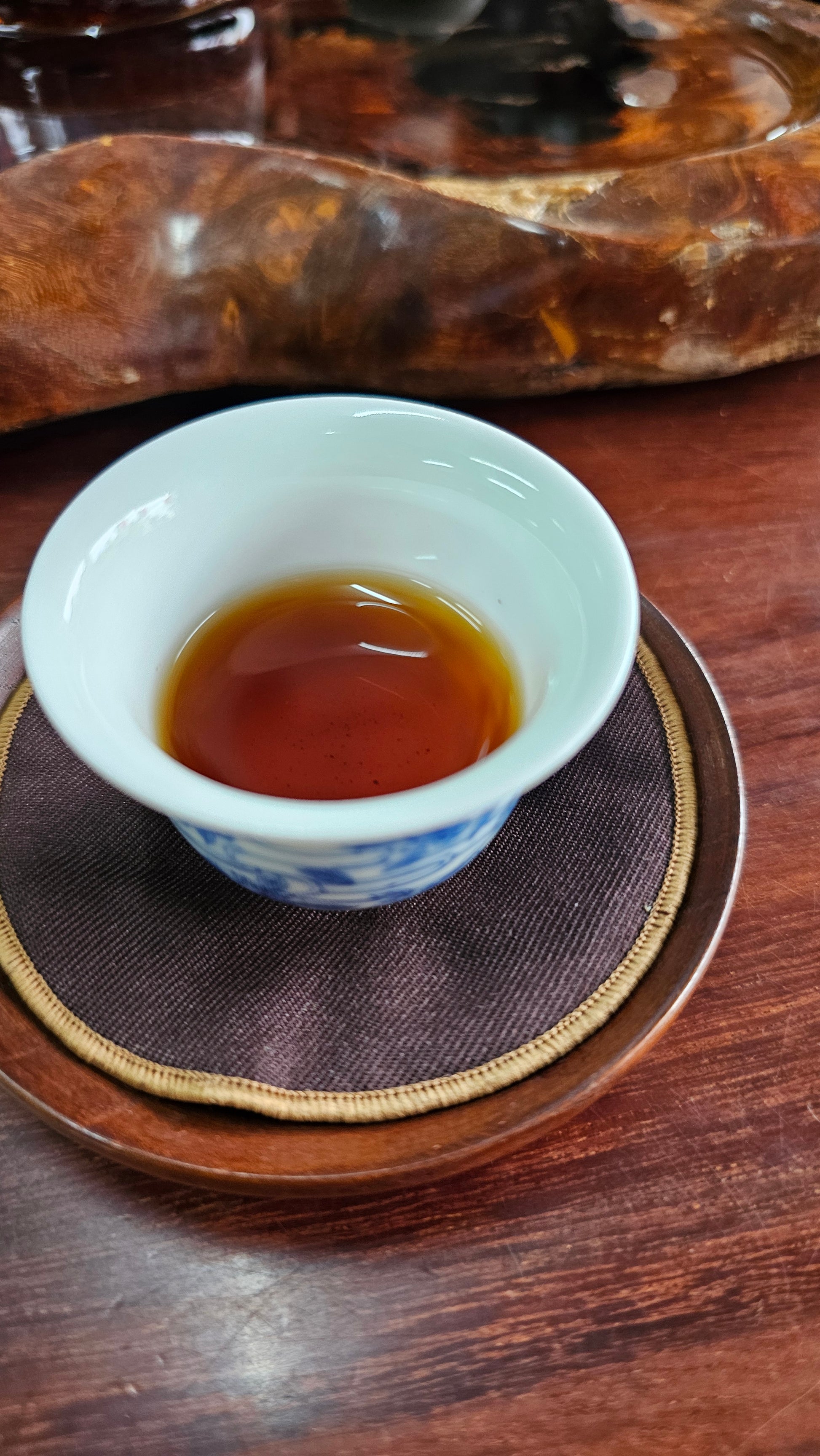 This 1998 Shu was crafted from ancient trees in a private commission. Deep ginseng aroma, sheng-like strength, and powerful grounding energy.