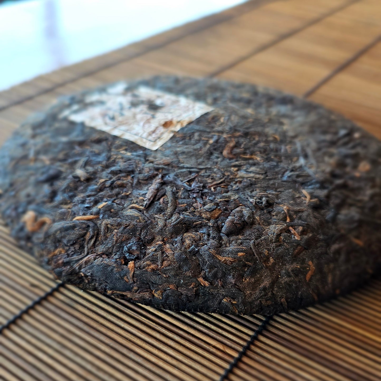 Pressed 2009 Shu Puerh cake labeled Remedy from Yong De, aged in Malaysia