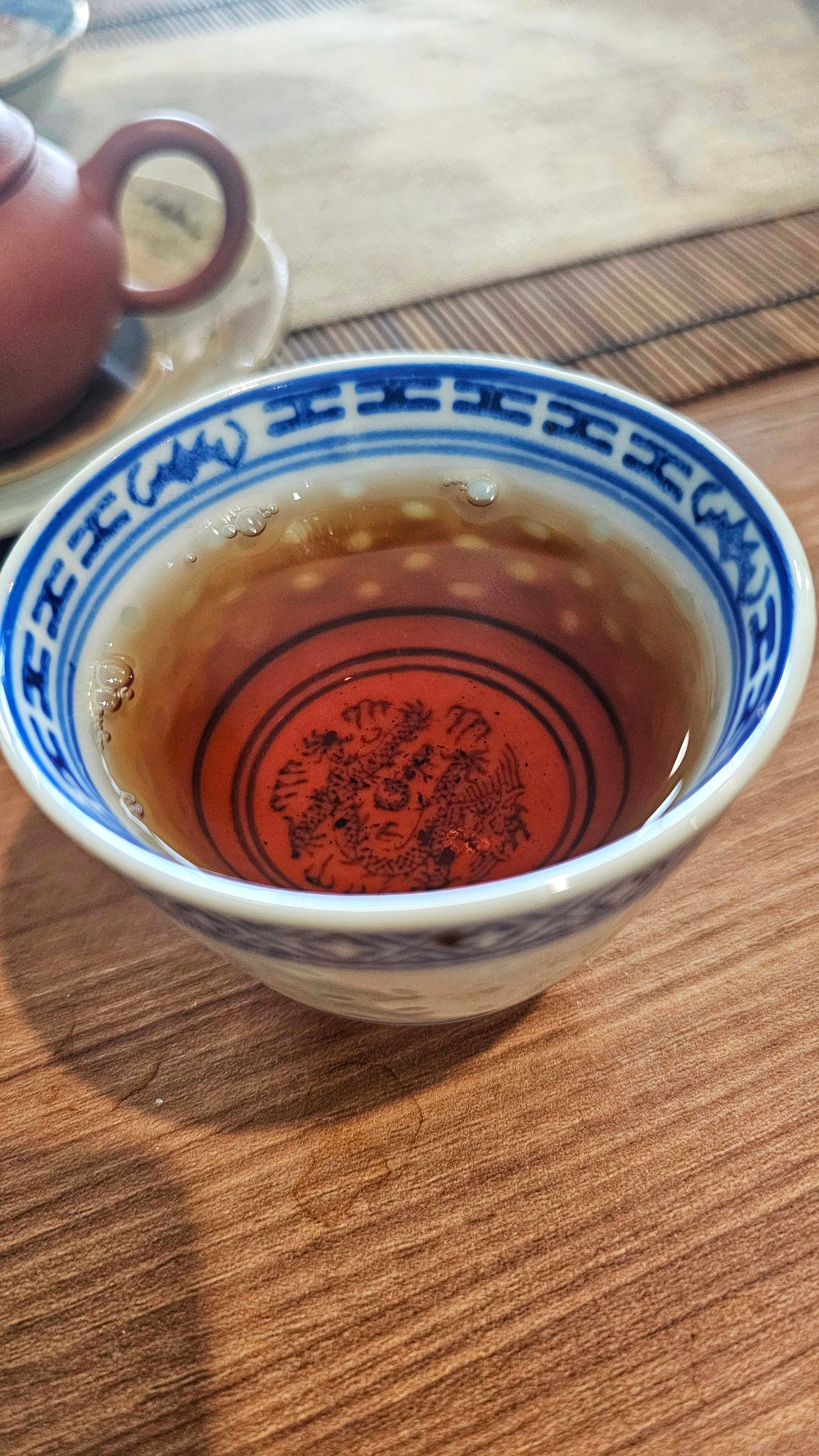 Rare wild tree Sheng from the 1990s. The Red Ribbon cake offers smooth camphor, honey notes, and deep grounding qi. A true vintage treasure.


