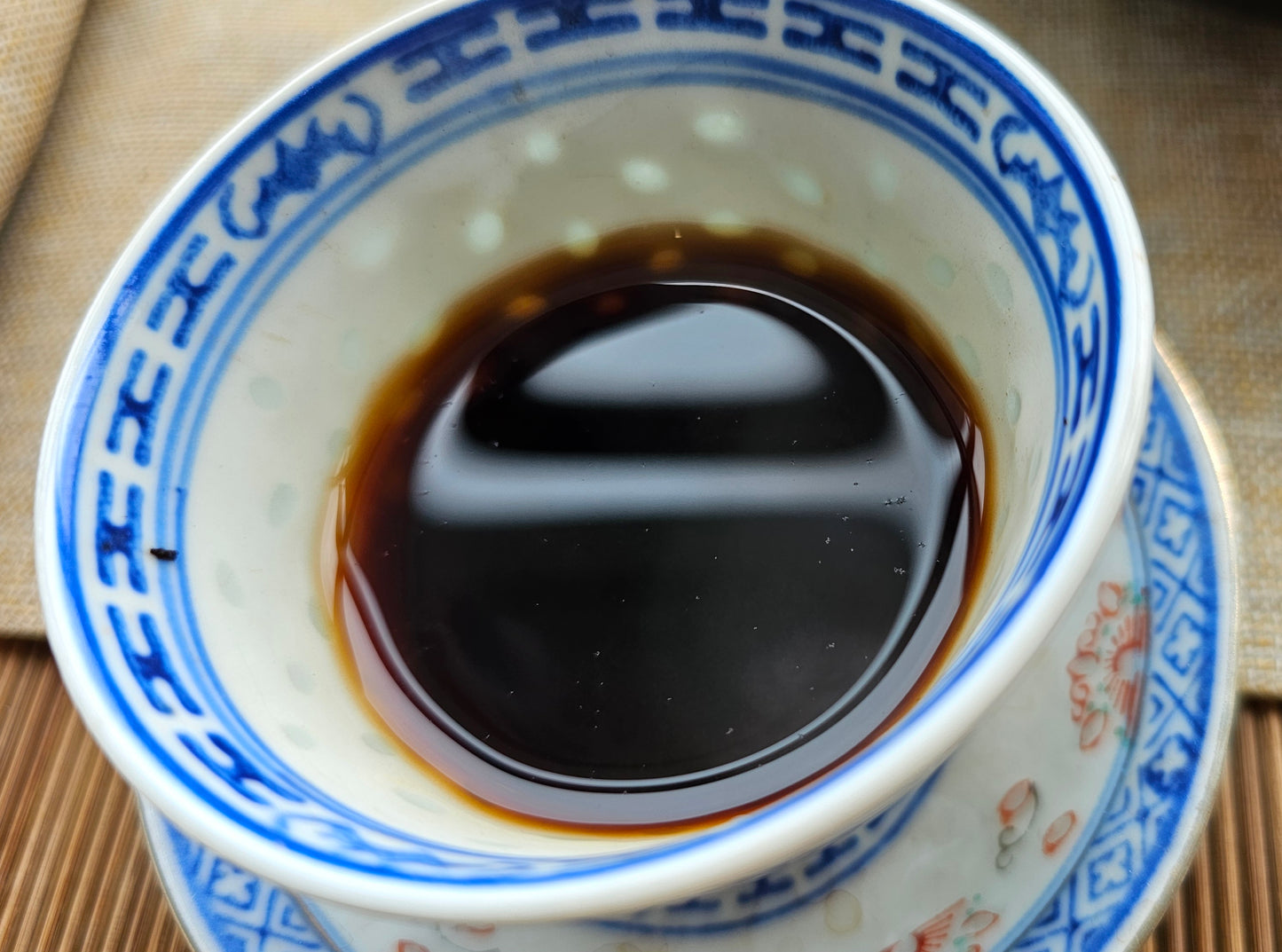 "Mahogany" 2012 Tong Xing Hao Clay Urn Malaysia Aged Shu Puerh. A deep, dark tea with resin, camphor, and nutty tones. Part of the 2025 sourcing sampler.