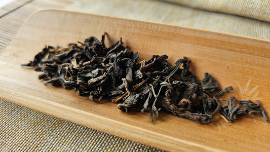Rare 1990s Sheng Puerh dry-aged in Malaysia. Strong huigan, medicinal ginseng notes, and deep grounding qi. Taste the essence of vintage mastery.