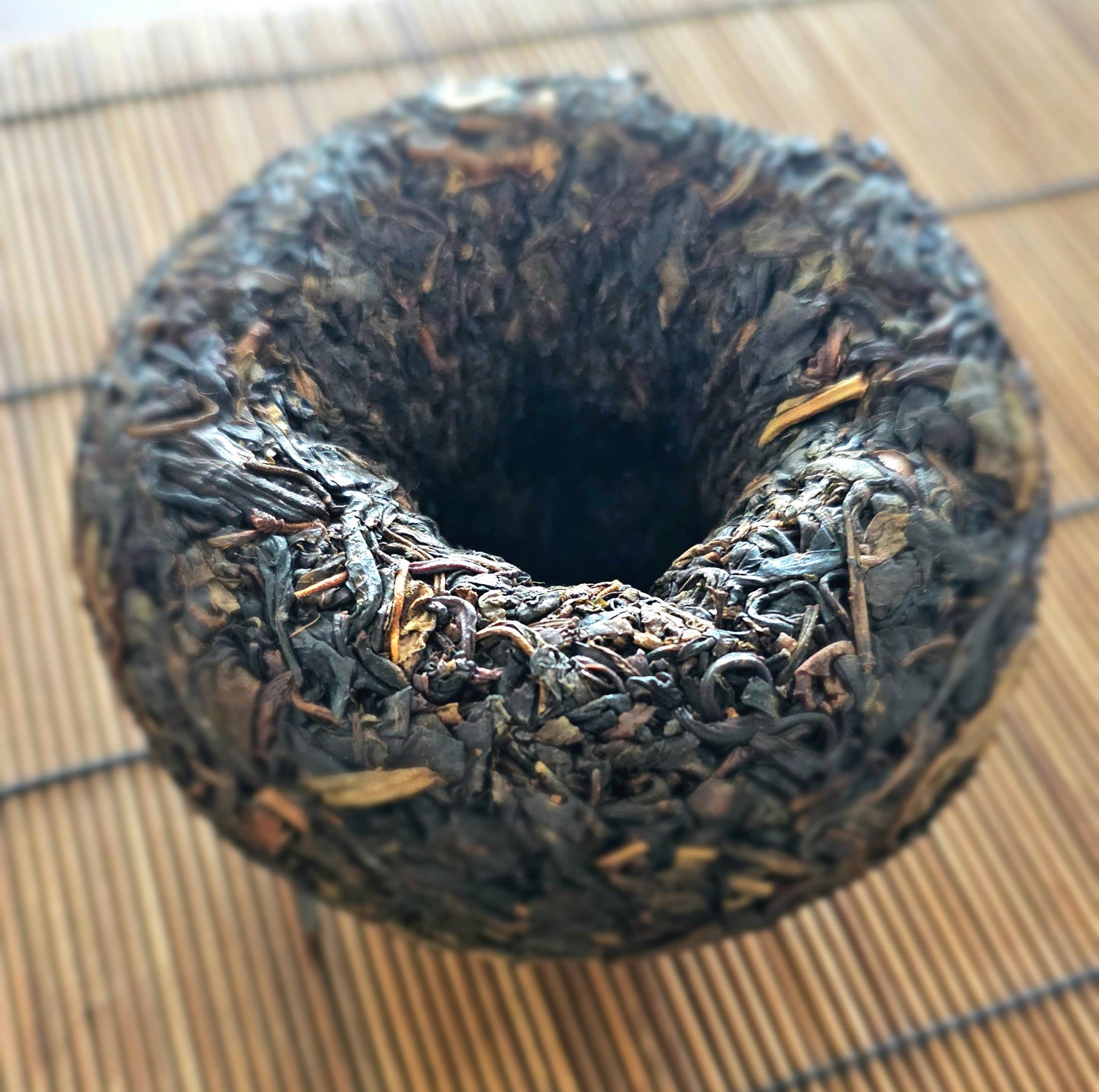 Sweet Smoke On Water is a rare 2013 gushu sheng tuocha from Dali Tea Factory. Smooth, wet-stored, and deeply calming. Sweetness lingers after every sip.